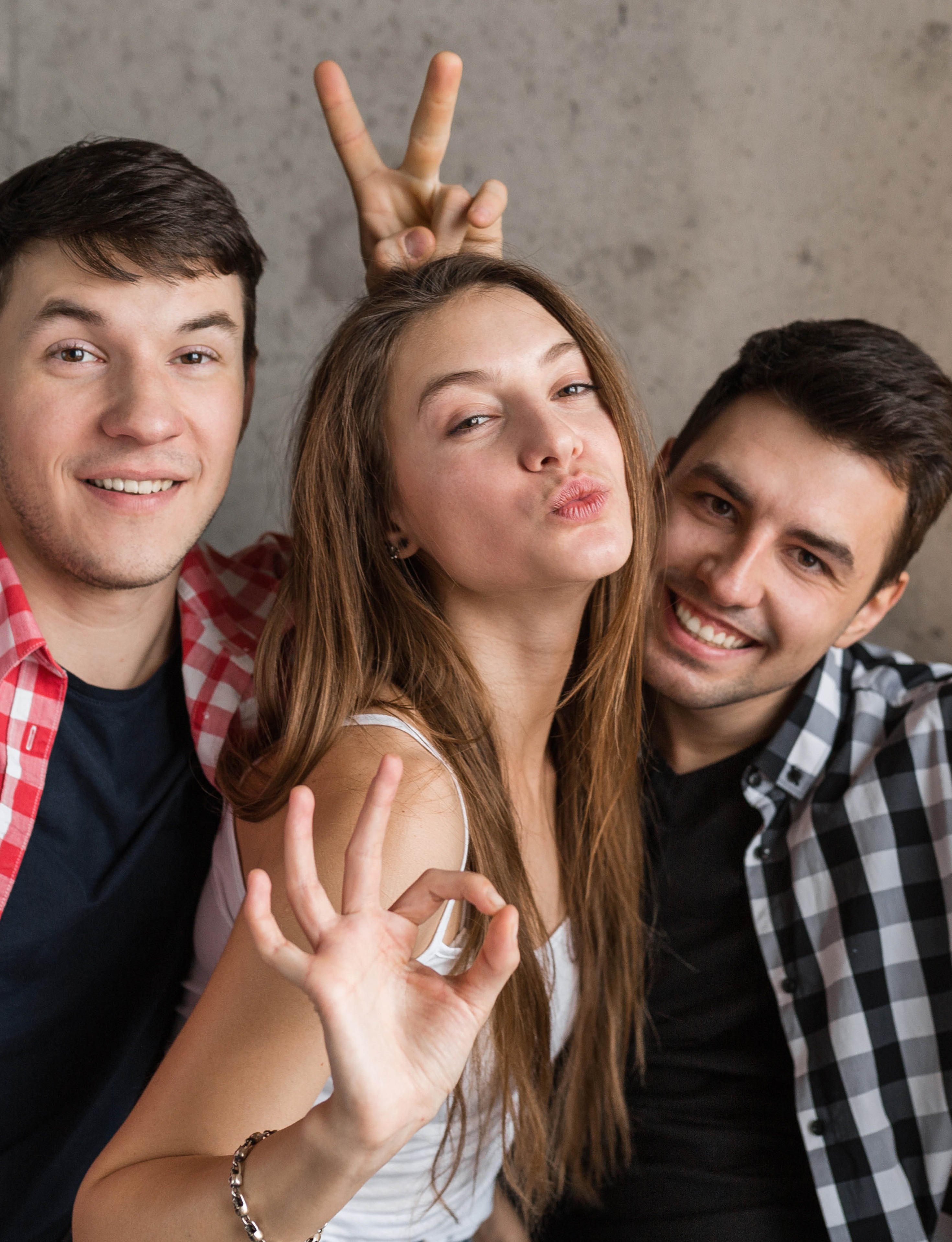 happy-young-people-making-funny-selfie-photo-sitting-on-sofa.jpg
